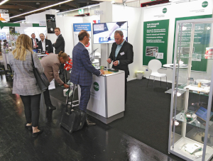 Visitors engaged in discussions with the PITSID stand staff